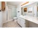 Clean bathroom featuring a vanity, large mirror, shower, and neutral decor at 4414 S Ventura Dr, Tempe, AZ 85282