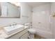 Well-lit bathroom featuring a sink with vanity, toilet, and a shower-tub combination at 4414 S Ventura Dr, Tempe, AZ 85282