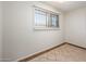 Bright bedroom featuring neutral walls, tile flooring, and a window with horizontal blinds at 4414 S Ventura Dr, Tempe, AZ 85282