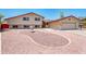 Charming two-story home with a well-manicured yard, fountain, and an attached two-car garage at 4414 S Ventura Dr, Tempe, AZ 85282