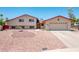 Charming two-story home with a well-manicured yard, fountain, and an attached two-car garage at 4414 S Ventura Dr, Tempe, AZ 85282
