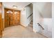 Welcoming foyer with a staircase, beautiful double-door entrance, and neutral tile flooring at 4414 S Ventura Dr, Tempe, AZ 85282