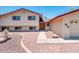 Inviting home exterior featuring unique landscaping and a double-door entrance at 4414 S Ventura Dr, Tempe, AZ 85282