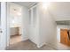 Upstairs hallway with closet space and partial view of bathroom at 4414 S Ventura Dr, Tempe, AZ 85282