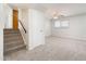This living room features neutral carpeting and a window for natural light at 4414 S Ventura Dr, Tempe, AZ 85282