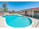 Inviting pool with steps for easy access, surrounded by a patio and secure fencing at 4414 S Ventura Dr, Tempe, AZ 85282