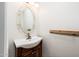 Charming powder room featuring a stylish vanity with a unique mirror at 4414 S Ventura Dr, Tempe, AZ 85282