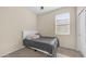 Small bedroom featuring a window, closet, and a ceiling fan at 44232 W Palo Cedro Rd, Maricopa, AZ 85138