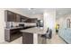 Well-equipped kitchen featuring granite countertops, dark cabinets, and stainless steel appliances at 44232 W Palo Cedro Rd, Maricopa, AZ 85138