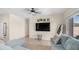 Cozy living room featuring a ceiling fan, and large-screen TV at 44232 W Palo Cedro Rd, Maricopa, AZ 85138