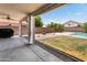 Backyard featuring a covered patio, seating area, and pool at 4684 W Tyson St, Chandler, AZ 85226