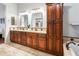 Large bathroom with granite counters, dual sinks, custom cabinets, tub and shower at 4684 W Tyson St, Chandler, AZ 85226
