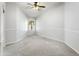 Empty bedroom with neutral carpet, a ceiling fan, a window, and fresh neutral paint with wainscoting at 4684 W Tyson St, Chandler, AZ 85226