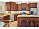 Kitchen with stainless steel appliances, granite countertops, a large island, and ample cabinet space at 4684 W Tyson St, Chandler, AZ 85226