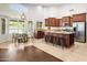 Spacious kitchen featuring stainless steel appliances, a large island, and a breakfast nook with pool views at 4684 W Tyson St, Chandler, AZ 85226