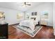 Spacious main bedroom features wood floors, ceiling fan and abundant natural light at 4684 W Tyson St, Chandler, AZ 85226