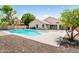 Inviting backyard pool surrounded by a concrete patio and desert landscaping at 4684 W Tyson St, Chandler, AZ 85226