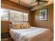 Cozy bedroom with neutral decor, a comfortable bed and a large window at 5331 E Mcdonald Dr, Paradise Valley, AZ 85253