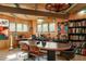 Large office space with a conference table, wood ceiling, and a wall of bookshelves at 5331 E Mcdonald Dr, Paradise Valley, AZ 85253