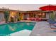 Backyard featuring a pool and outdoor dining area with ample patio space for entertaining at 5331 E Mcdonald Dr, Paradise Valley, AZ 85253