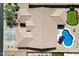 Aerial view of house highlighting the unique roofline, blue pool, and putting green at 5332 E Thunder Hawk Rd, Cave Creek, AZ 85331