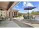 Inviting patio area with comfortable seating and a dining table with a large umbrella at 5332 E Thunder Hawk Rd, Cave Creek, AZ 85331