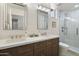 Stylish bathroom featuring dual sinks and a glass shower at 5332 E Thunder Hawk Rd, Cave Creek, AZ 85331