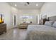 Spacious bedroom with a large window, sitting area, and stylish furnishings at 5332 E Thunder Hawk Rd, Cave Creek, AZ 85331
