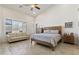 Bright bedroom featuring a large bed, sitting area, and an abundance of natural light from big windows at 5332 E Thunder Hawk Rd, Cave Creek, AZ 85331