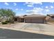 Charming single-story home featuring a three-car garage, well-manicured landscaping, and desert-friendly plants at 5332 E Thunder Hawk Rd, Cave Creek, AZ 85331