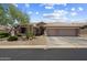 Charming single-story home featuring a three-car garage, well-manicured landscaping, and desert-friendly plants at 5332 E Thunder Hawk Rd, Cave Creek, AZ 85331