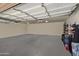 Empty garage with overhead lighting, ample space, and built-in shelving at 5332 E Thunder Hawk Rd, Cave Creek, AZ 85331