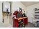 Garage with work bench, red tool chest, and water heater at 5332 E Thunder Hawk Rd, Cave Creek, AZ 85331