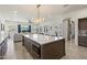 Bright kitchen with a huge island and seating that opens to the connected living area in this home at 5332 E Thunder Hawk Rd, Cave Creek, AZ 85331