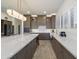 Bright kitchen with a big island with modern countertops, lighting, stainless appliances, and large windows at 5332 E Thunder Hawk Rd, Cave Creek, AZ 85331