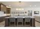Modern kitchen with a large center island, white countertops, dark wood cabinets, and stainless steel appliances at 5332 E Thunder Hawk Rd, Cave Creek, AZ 85331