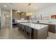 Spacious kitchen featuring a large island with countertop seating and modern stainless steel appliances at 5332 E Thunder Hawk Rd, Cave Creek, AZ 85331