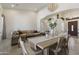 Open-concept living space with comfortable seating, a dining area with a chandelier, and lots of natural light at 5332 E Thunder Hawk Rd, Cave Creek, AZ 85331