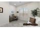 Bright office space with a couch and natural light from a large window at 5332 E Thunder Hawk Rd, Cave Creek, AZ 85331