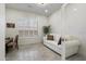 Bright office space with a couch and natural light from a large window at 5332 E Thunder Hawk Rd, Cave Creek, AZ 85331