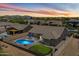 Beautiful backyard with pool, putting green, pergola, desert landscape and a stunning sunset at 5332 E Thunder Hawk Rd, Cave Creek, AZ 85331