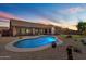 Inviting backyard features a sparkling pool, desert landscaping, outdoor seating, and clear sky views at 5332 E Thunder Hawk Rd, Cave Creek, AZ 85331