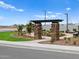 Serene community park with trellis entrance, desert plants, and walking paths at 5464 S 246Th Ln, Buckeye, AZ 85326