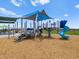 Community playground with blue slide, play structure, and mulch ground cover at 5464 S 246Th Ln, Buckeye, AZ 85326