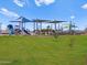 Community playground featuring slides and covered play areas for outdoor fun at 5464 S 246Th Ln, Buckeye, AZ 85326