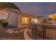 Charming backyard features a well-maintained patio area, outdoor bar seating, and view of the pool at 6648 S Lyon Dr, Gilbert, AZ 85298