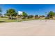 Outdoor basketball court featuring hoops, a smooth surface, and perimeter lighting at 6648 S Lyon Dr, Gilbert, AZ 85298