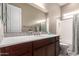 Well-lit bathroom features granite counters, modern fixtures, and a separate tub and shower at 6648 S Lyon Dr, Gilbert, AZ 85298
