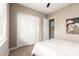 Bright bedroom with double sliding closet doors, neutral decor and carpet at 6648 S Lyon Dr, Gilbert, AZ 85298