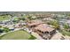 Birds-eye view showcasing the clubhouse with golf carts, set near lush green golf course at 6648 S Lyon Dr, Gilbert, AZ 85298